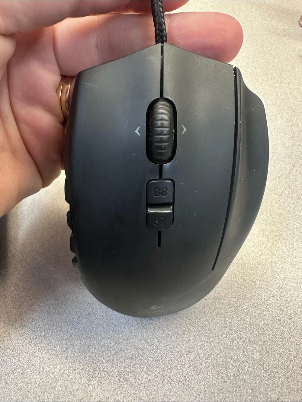Logitech G600 Black Wired Ergonomic Gaming Mouse with 12 button thumb grid.